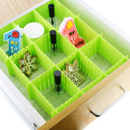 Adjustable drawer organizer set in a kitchen drawer, showcasing multipurpose storage.