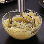 Versatile stainless steel hand masher with a comfortable grip, for all your kitchen mashing needs.