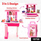 Girl playing with portable kitchen set, showing cooking toys