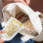 Reusable food storage pouch with airtight zipper seal, 150ml, perfect for snacks.