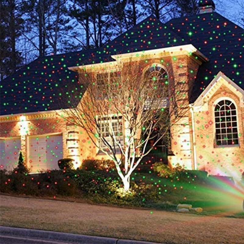 Multicolor outdoor laser projector illuminating a building for home or office decor.
