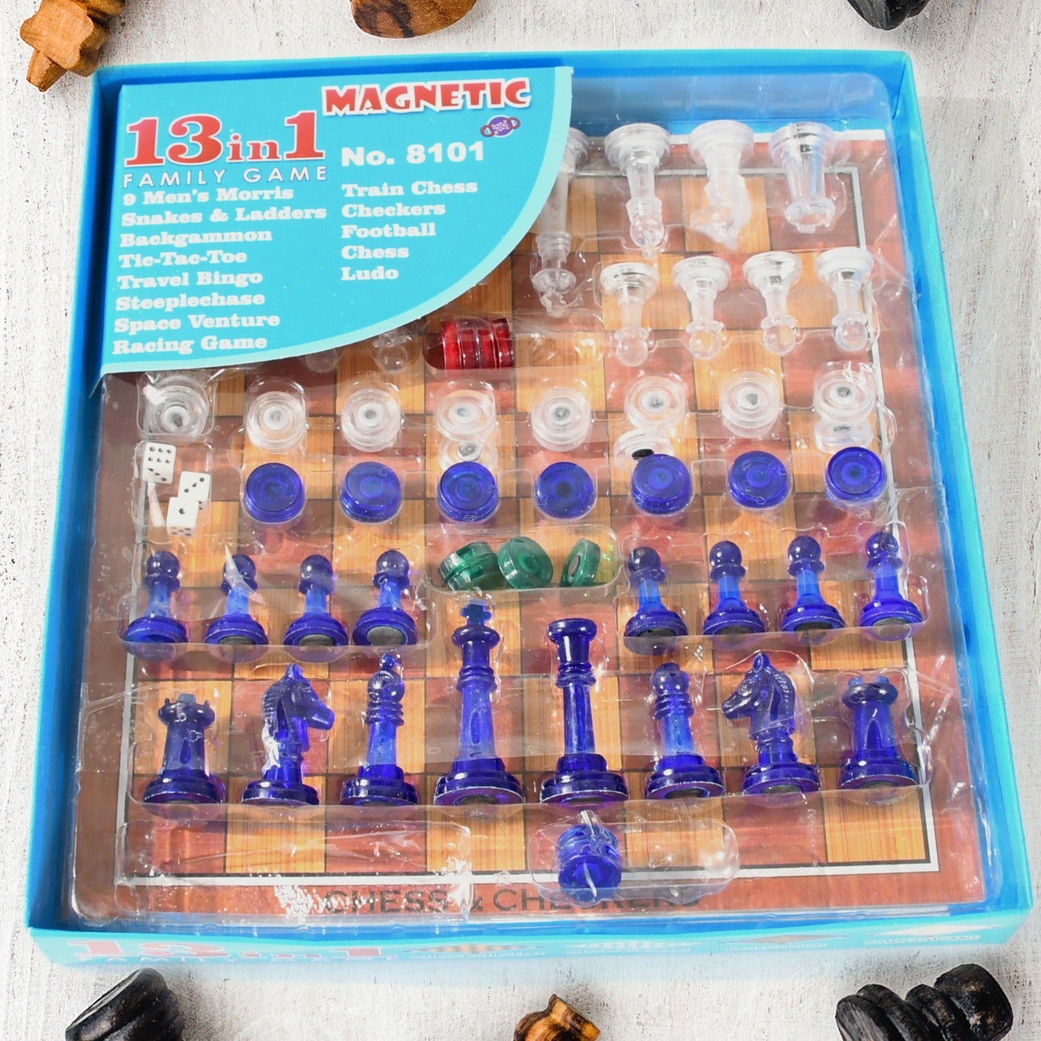 Dollamis 13-in-1 Family Board Game Set displayed with chess pieces and other game boards.