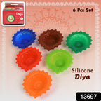 Close-up of a lit silicone diya, highlighting its vibrant colour and intricate design.
