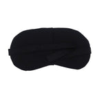 Side view of a sleep mask for travel, showing the adjustable elastic strap for a secure fit.