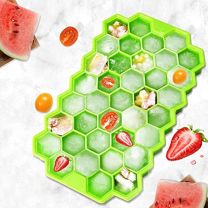 Close-up of small honeycomb ice cubes in a flexible silicone tray.