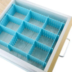 Kitchen drawer organized with the 6-piece adjustable dividers, holding cutlery.