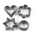 Assorted stainless steel cookie cutters, including heart, star, and flower designs, ready for baking.