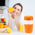 Compact manual citrus juicer with durable construction and non-slip base.