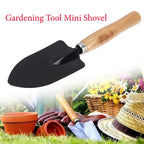 Ergonomic steel hand trowel with a black handle, ready for planting.