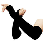 Person wearing black compression arm sleeves for sun protection during outdoor activity.