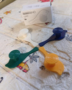 Close-up of a self-adhesive bird hook securely holding a small accessory.