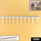 Close-up view of adhesive mounted kitchen utensil hanging rack