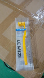 Ergonomic head of the ultra-soft Six-Sided Toothbrush, designed for effective plaque removal.