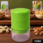 Hand using the Konvex dry fruit cutter to slice almonds and other nuts.