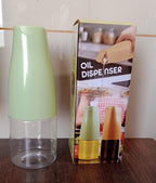 The 500ml oil dispenser filled with cooking oil, ready for use on the counter.