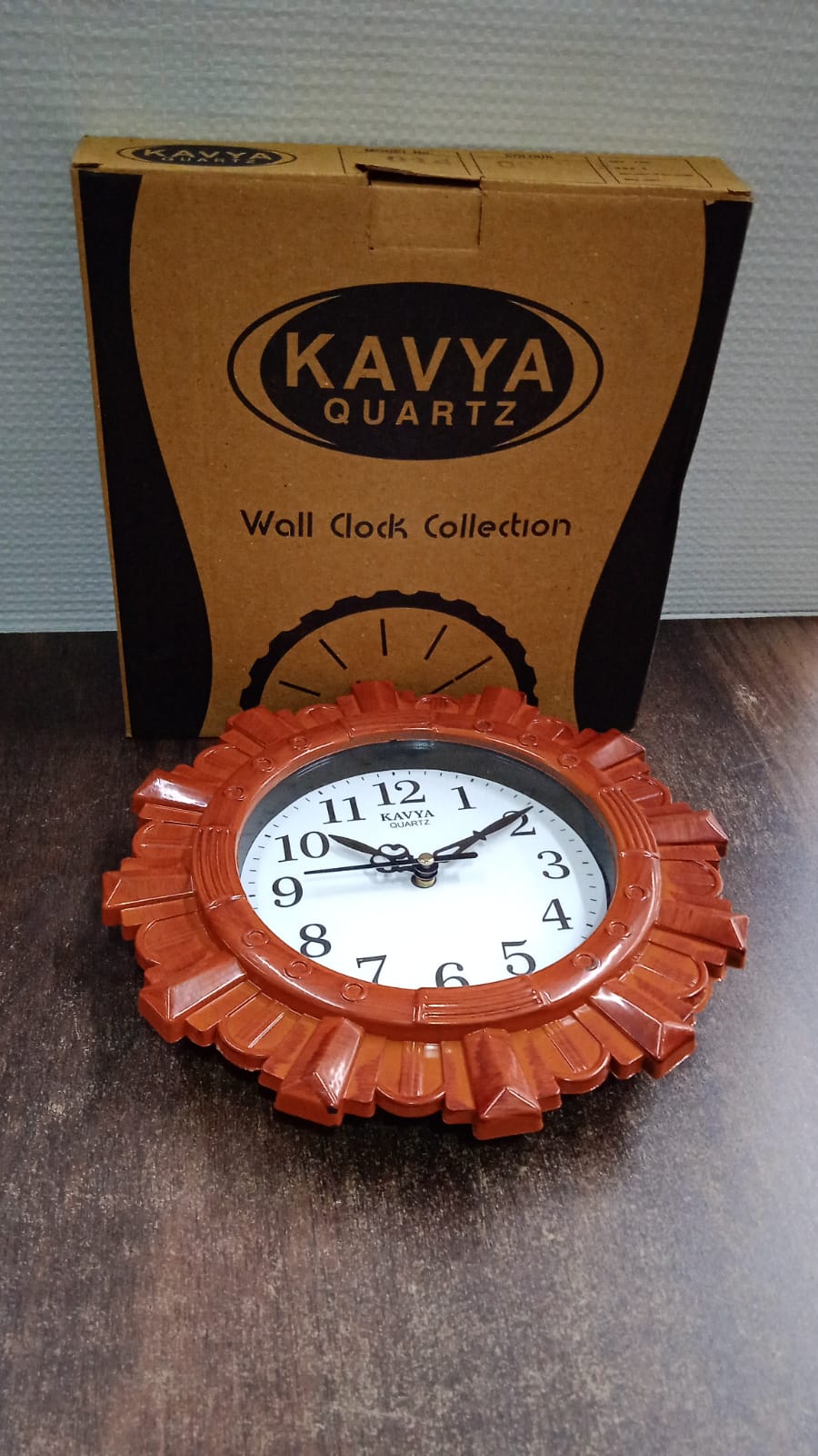 Aesthetic wooden look round wall clock elegantly displayed in a contemporary room setting.