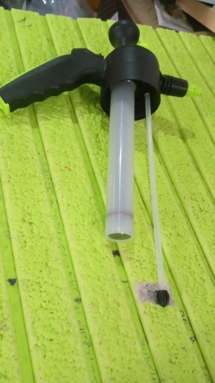 Angled view of the adjustable watering can spray nozzle for potted plants.