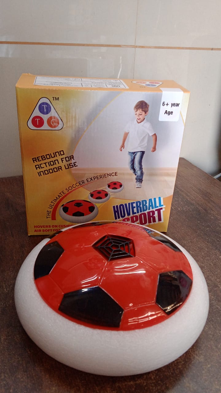 Hover soccer ball toy with foam bumper resting on indoor floor