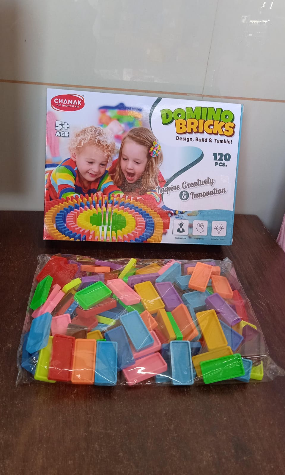 Neat stack of vibrant wooden domino blocks, ready for kids to play.