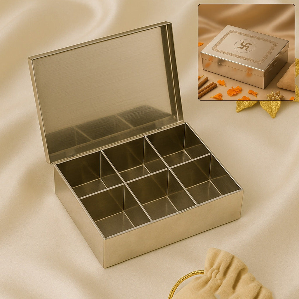 Top-down view of the open stainless steel jewelry box, ready for storage.