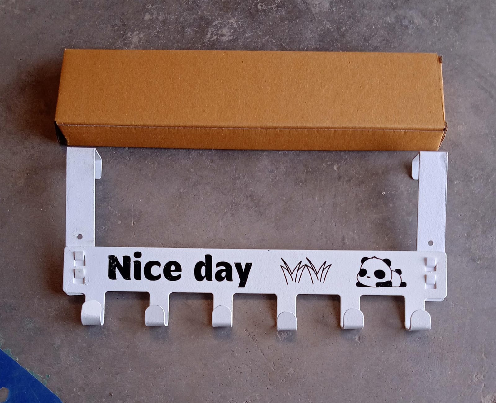 Full view of white heavy-duty over door hook hanger rack with 6 hooks