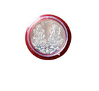 Pooja Coin with packaging displayed on ceremonial cloth
