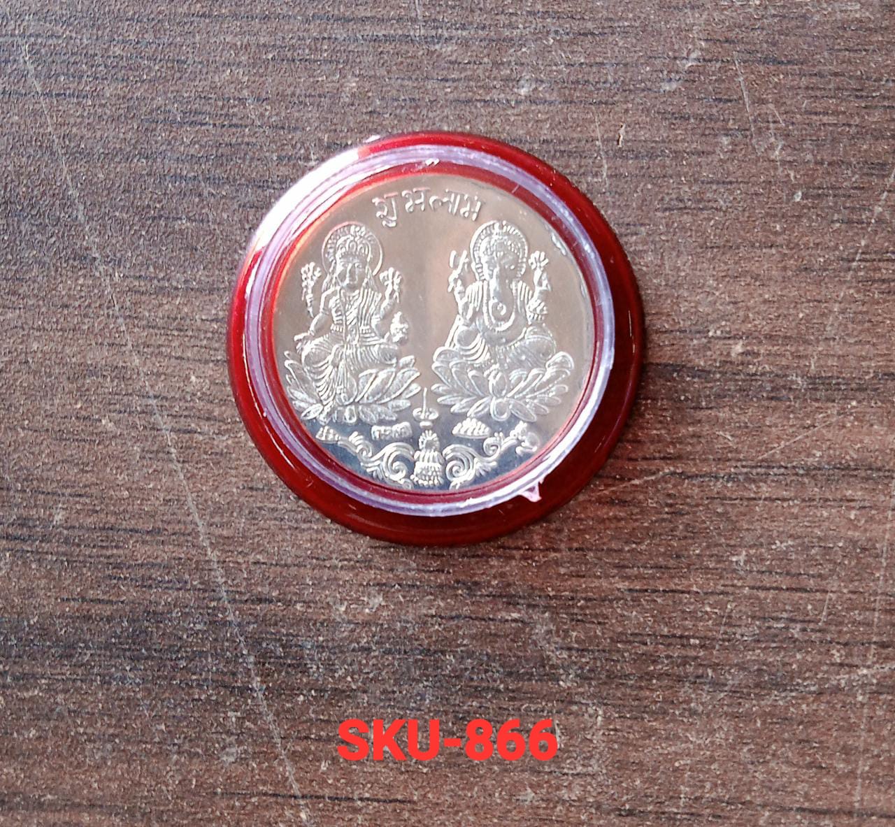 Goddess Lakshmi Pooja Coin placed on cloth background for pooja rituals