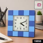Close-up view of the modern block-pattern frame of the quartz table clock.