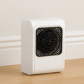 Compact brown box room heater on a clean surface.