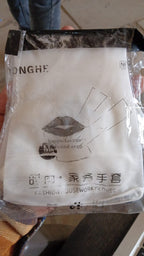 A single pair of storenzo's durable PVC cleaning gloves on a white background.