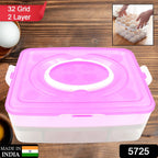 Person holding portable 32-grid egg storage tray by handle