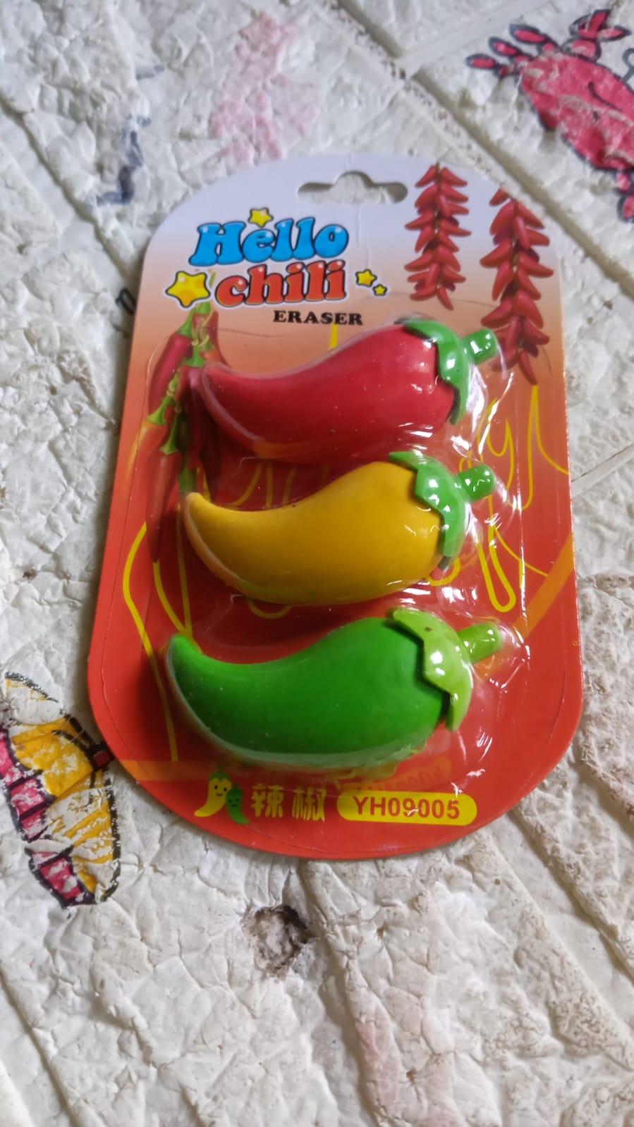 A collection of 3D chili shape erasers, showcasing the variety in the set.