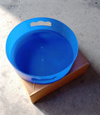 Revolving tray storage unit featuring a convenient brown box.