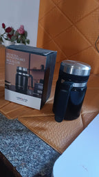 Vacuum coffee cup exhibiting ergonomic handle and stainless steel body design