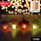 Close-up of a wireless LED decorative light, designed as a vase with silk flowers.
