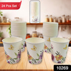 Stack of colourful disposable paper cups with various patterns.