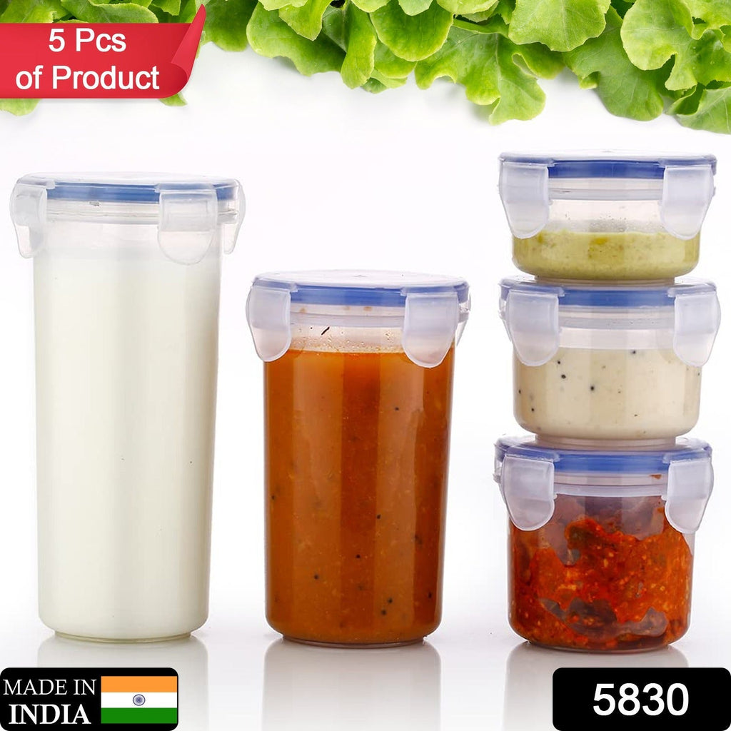 Stackable round plastic containers showcasing their leak-proof seal for various food items.