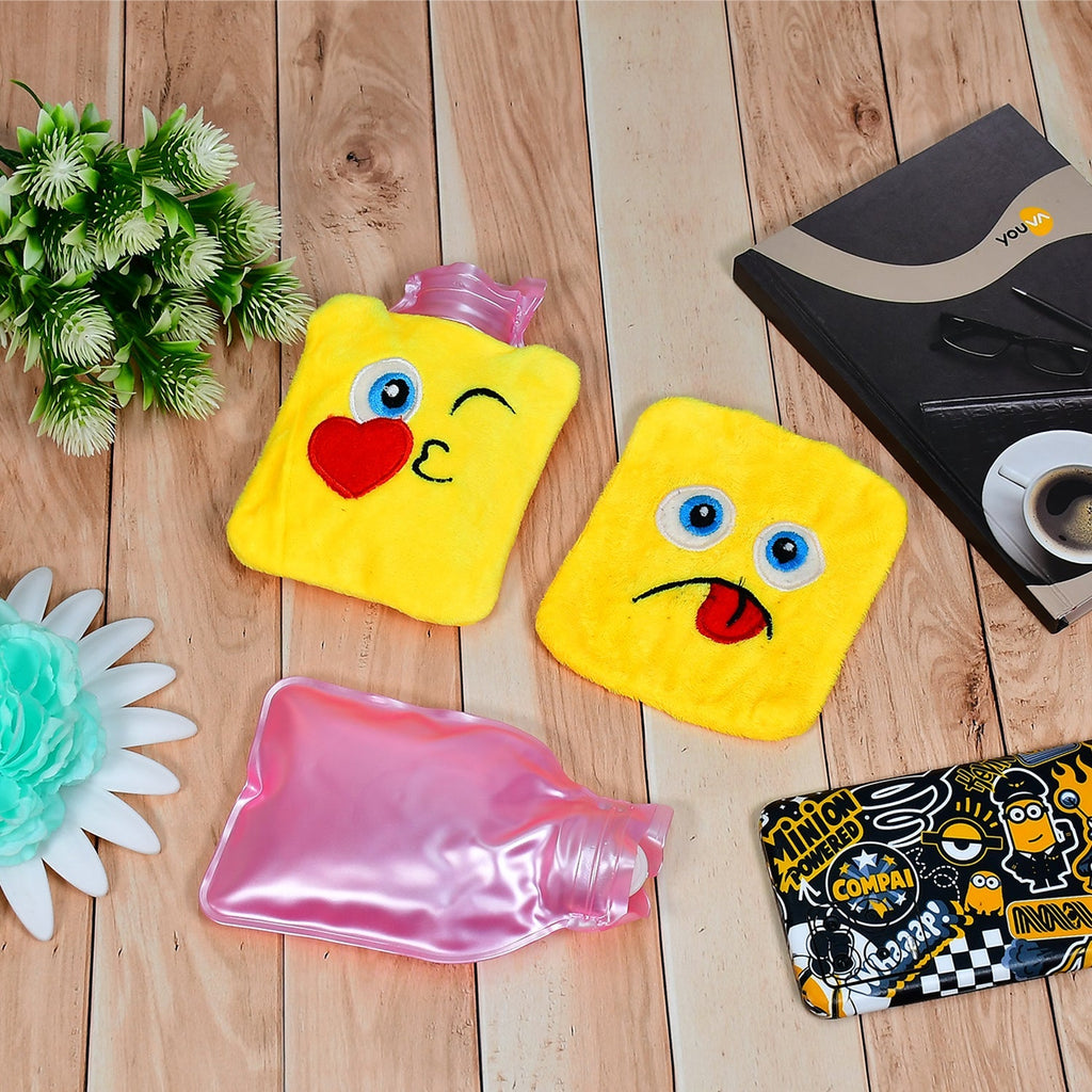 Pink mini hot water bag with a smiling emoji design, offering pain relief.
