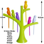A single green bird fruit fork nestled in the decorative tree holder.