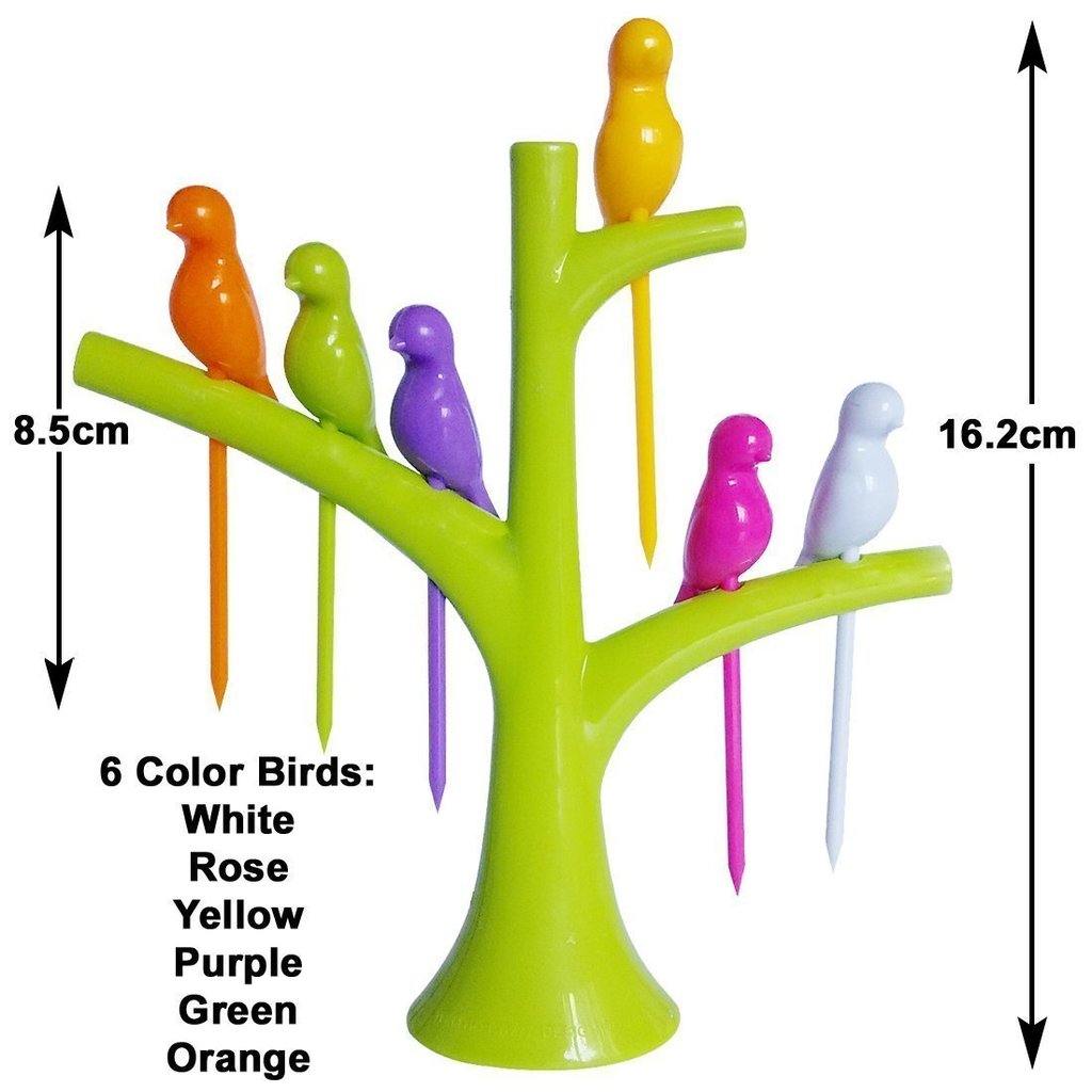 A single green bird fruit fork nestled in the decorative tree holder.