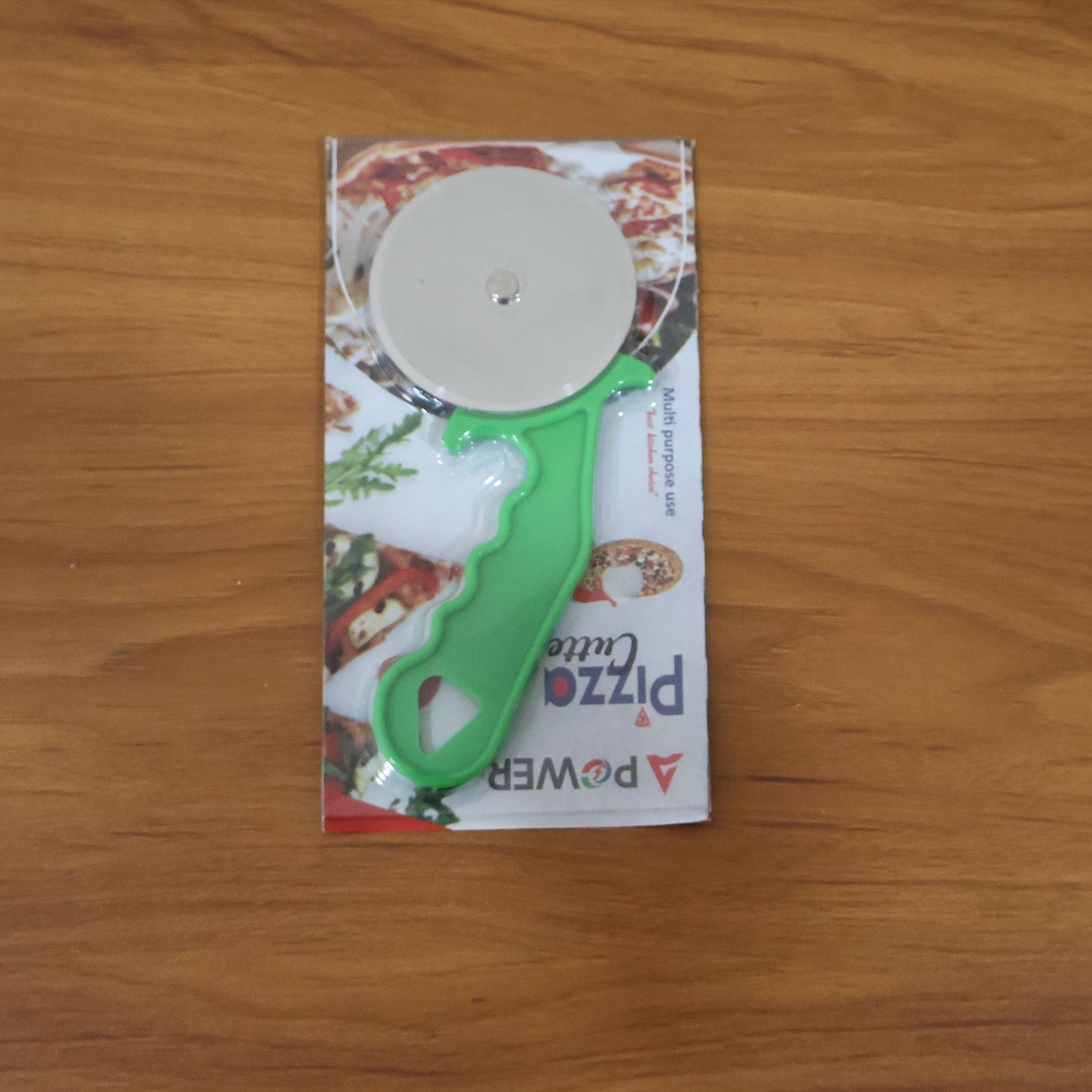 Quickslice pizza cutter displayed alongside a variety of pastries and sandwiches, highlighting its versatility.