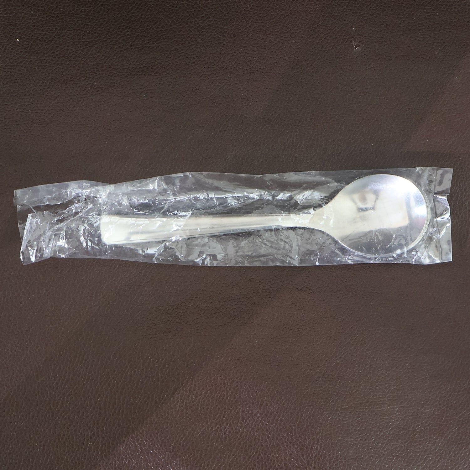 Dining spoons placed on kitchen table highlighting ergonomic design