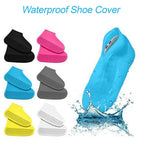 A person wearing non-slip silicone boot covers over shoes, walking on a wet surface.