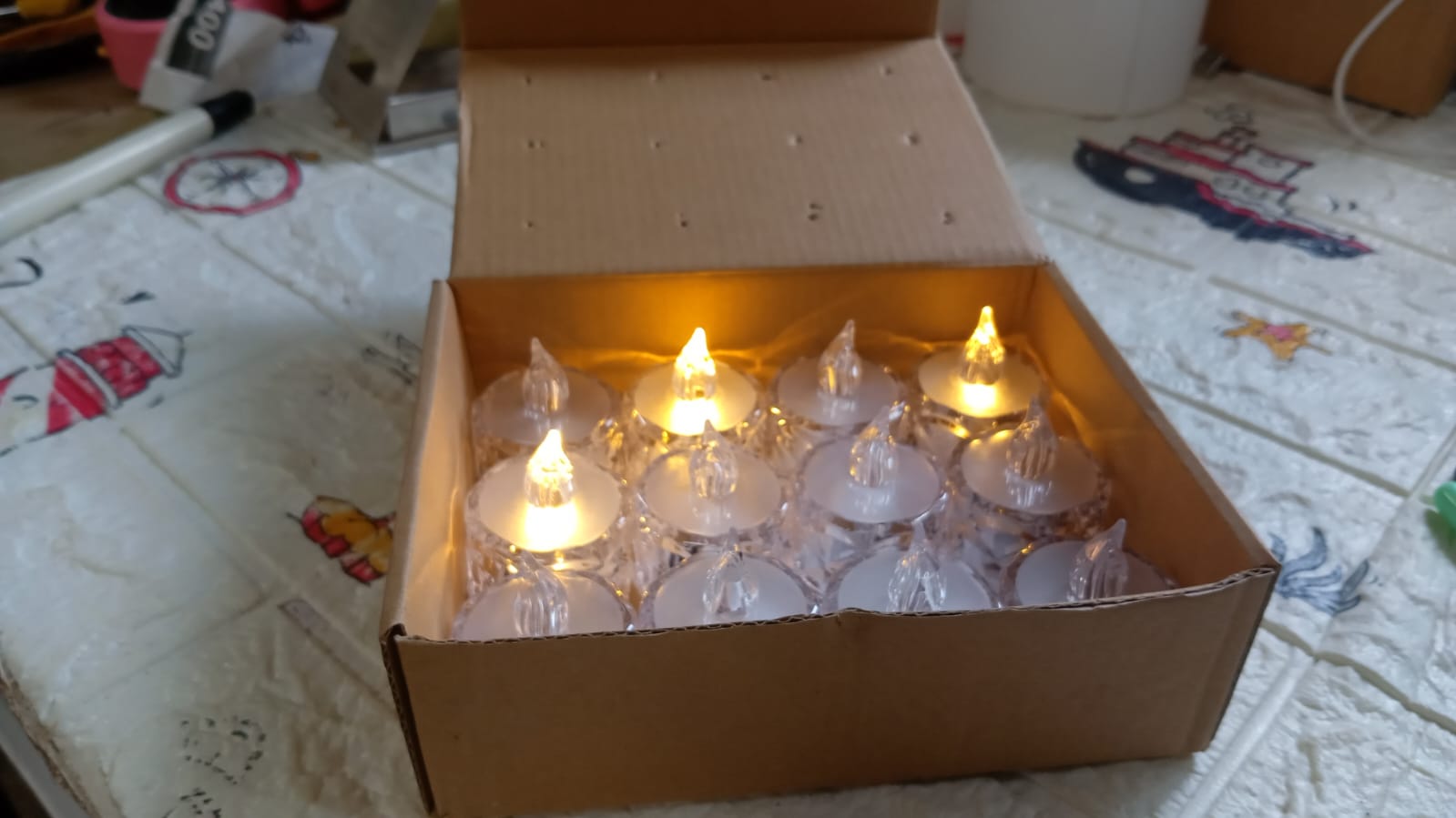 The Flameless LED Tealight Candles box packaging, showing 24 pieces.