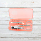 AuriGlam portable nail clipper set in its clear plastic travel case.