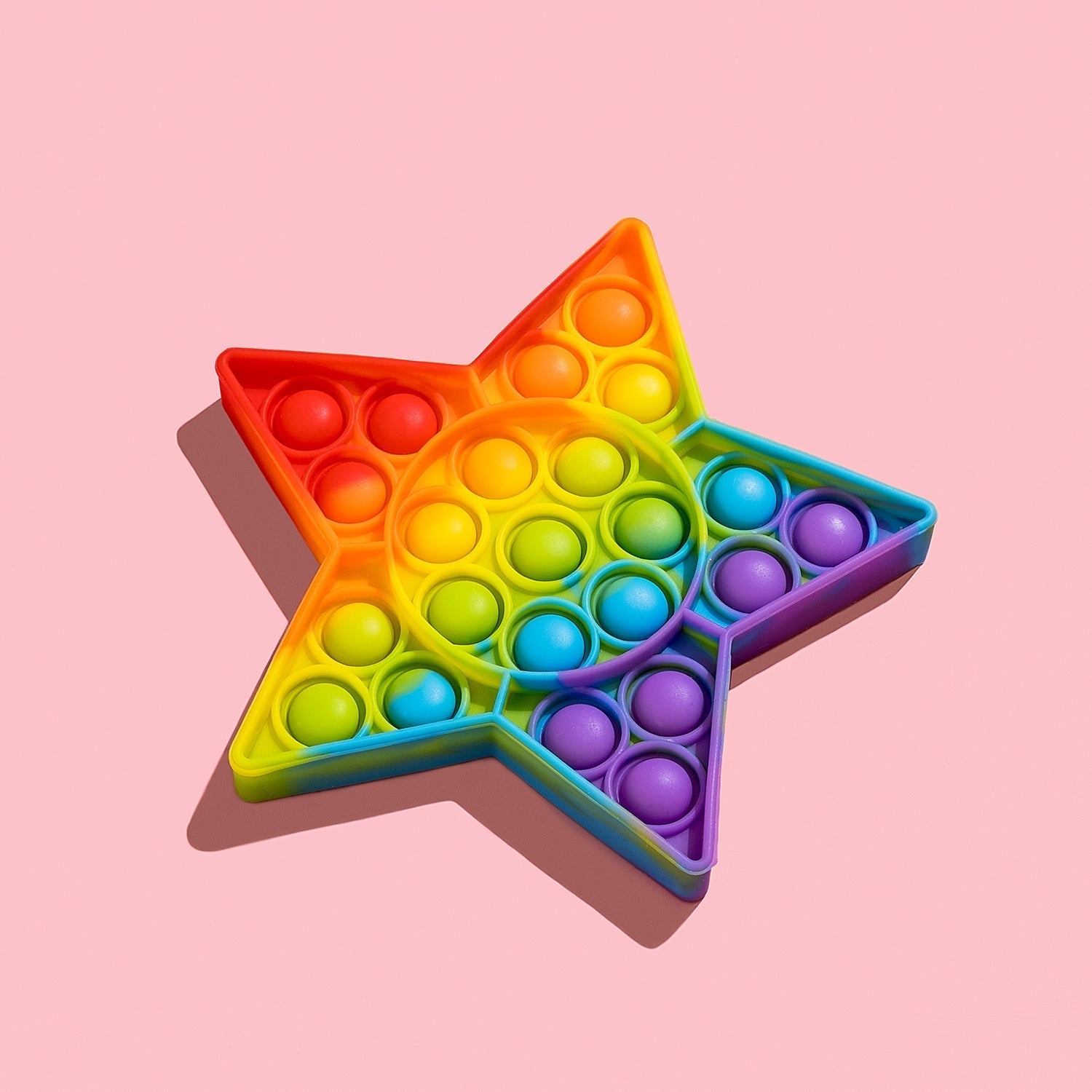 A hand holding the Star Fidget Toy, demonstrating its ergonomic and kid-friendly size.