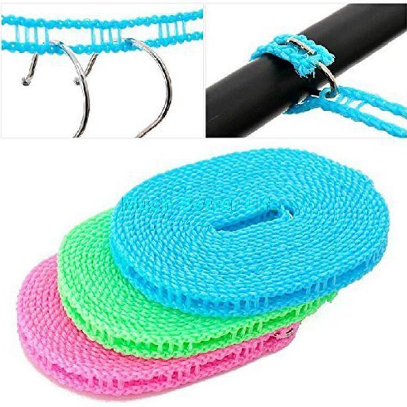 Windproof nylon clothesline securely holding clothes on a balcony outdoors.