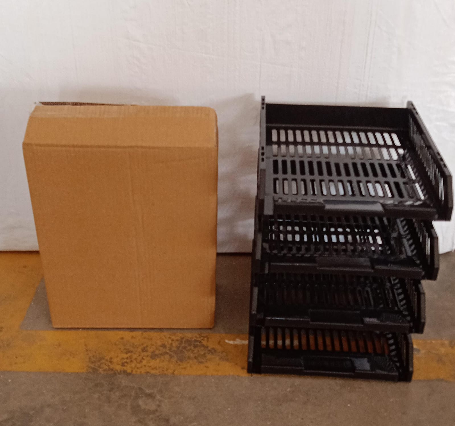 A drawer of the office file rack being opened on an office desk.