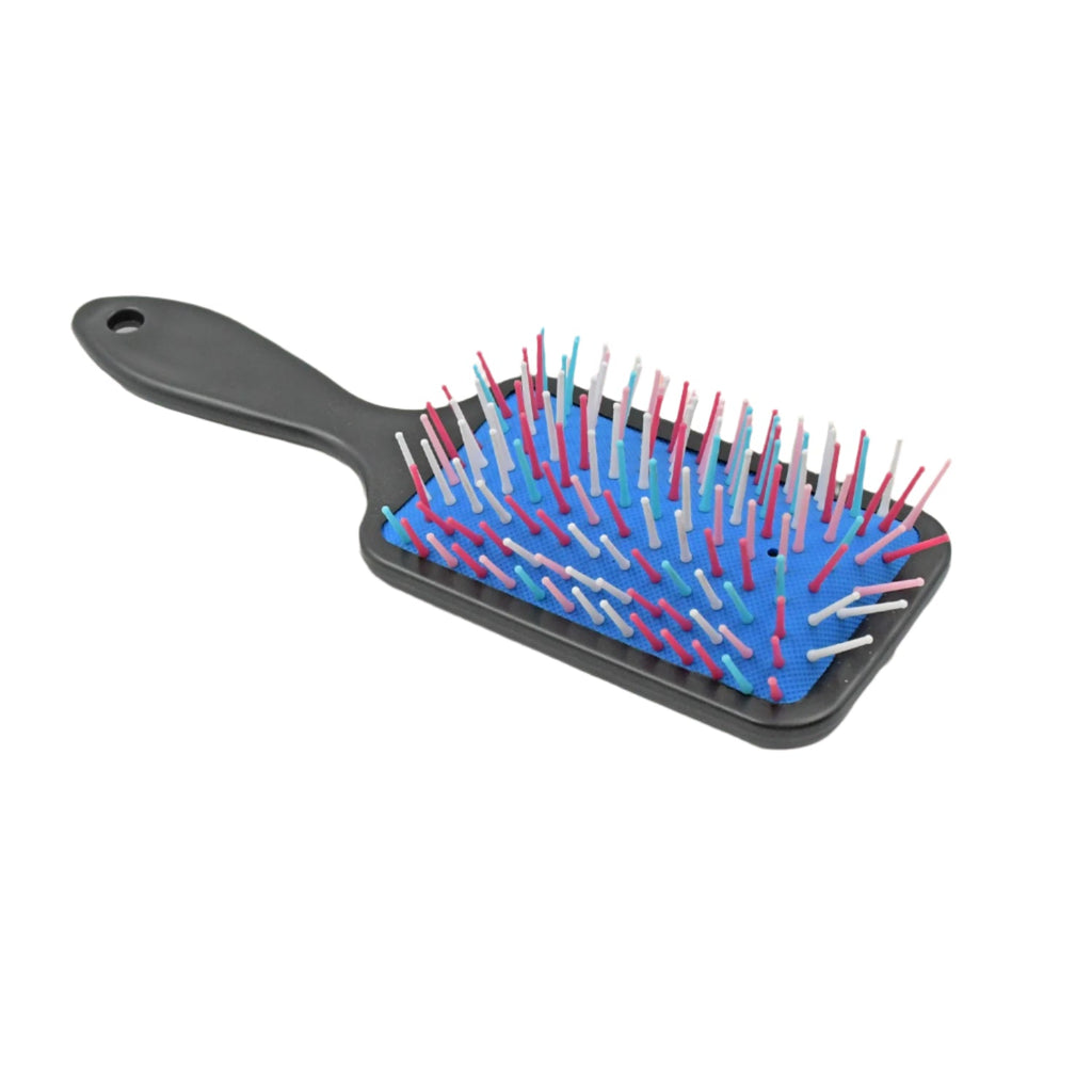 Hand using the Scalp Massager Comb on a scalp, demonstrating gentle massage action.