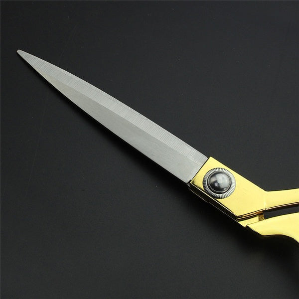 Sharp gold-plated scissors ready for seamless cutting of fabrics and leather.